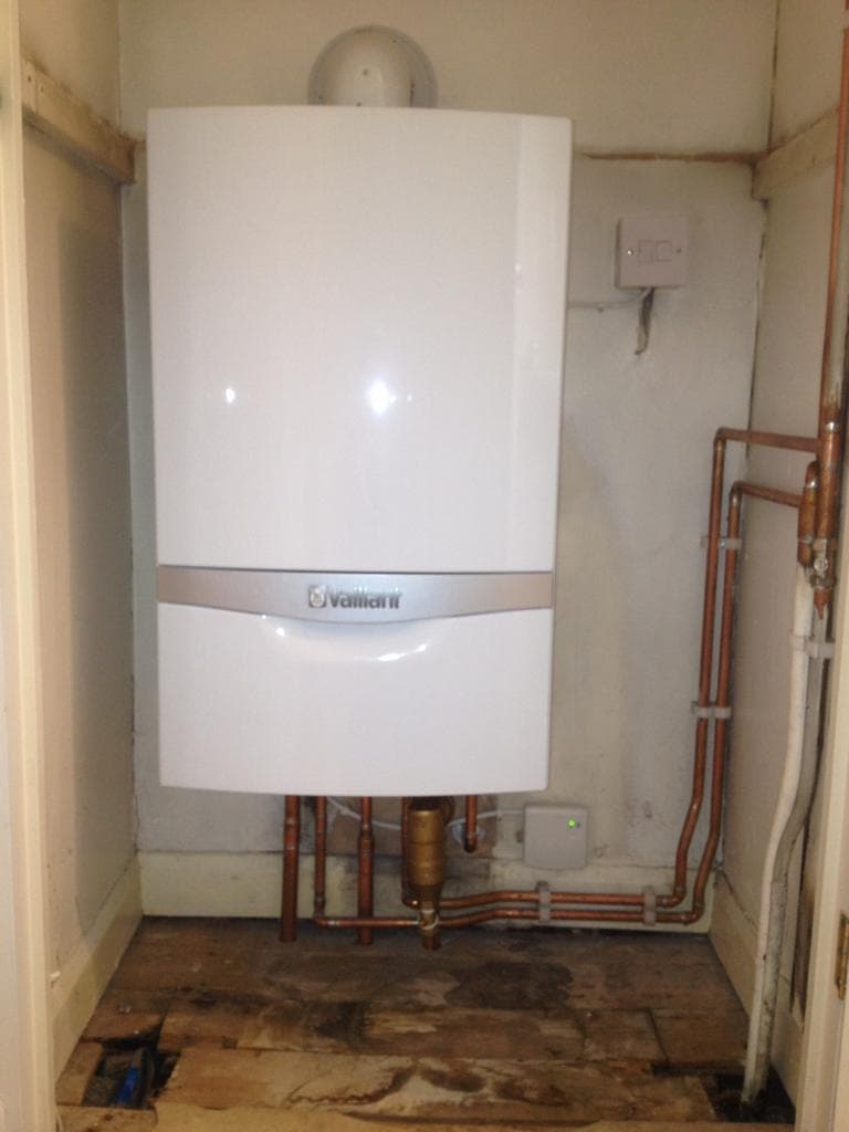 Vaillant boiler fitted in a cupboard during installation