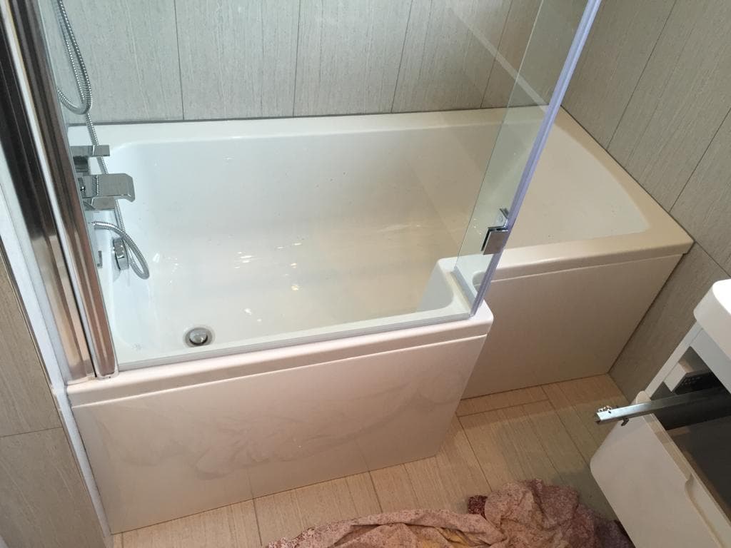Shower bath with glass screen and bath panel